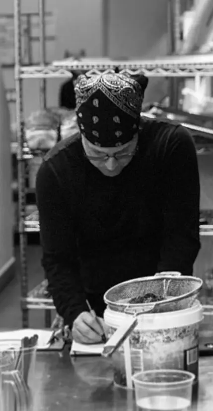 Steven Bonin working at the pass — 30 years in F&B before picking up a bookkeeping ledger